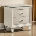 Goldoma traditional 2-drawer nightstand with diamond clear acrylic legs in pearl white finish placed next to a bed