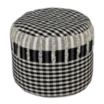 Goldoma 18-inch black cotton plaid pouf ottoman used as a footrest in a living room