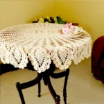 Vintage lace table mats in shabby chic style on a wooden table