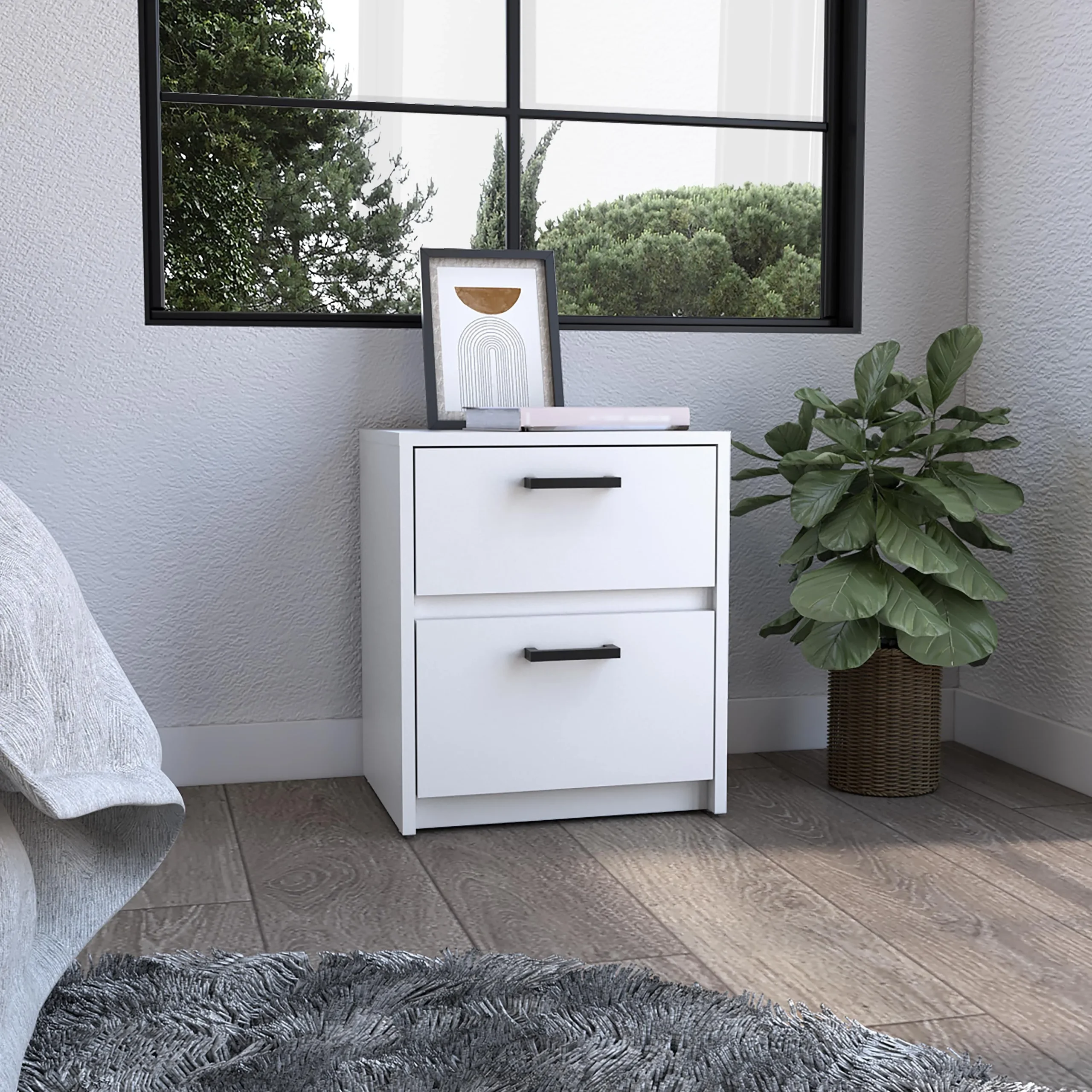 Minimalist white nightstand with two drawers next to a bed