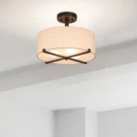 Detail shot of the lamp's metal canopy and mounting hardware against a white ceiling.