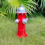 Fire hydrant ornament with dewdrops on its surface, early morning.