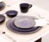 Hand painted dinnerware set with floral patterns on a wooden table