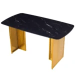 Modern glass dining table set with marble pattern and gold metal legs in a dining room setting
