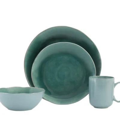 Eco-friendly green dinnerware set with plates and cups on a wooden table