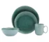 Eco-friendly green dinnerware set with plates and cups on a wooden table