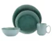 Eco-friendly green dinnerware set with plates and cups on a wooden table