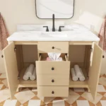 Goldoma bathroom vanity with sink, angled view against a tiled wall, highlighting the curved silhouette and ample