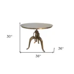 Adjustable height round dining table with antiqued nickel three-leg pedestal base and rivet detailing