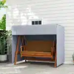 Dark gray outdoor swing cover protecting a patio hammock swing from rain and sun