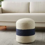 Off-white and navy blue jute blend cylinder ottoman pouf with striped pattern - boho footrest and extra seat