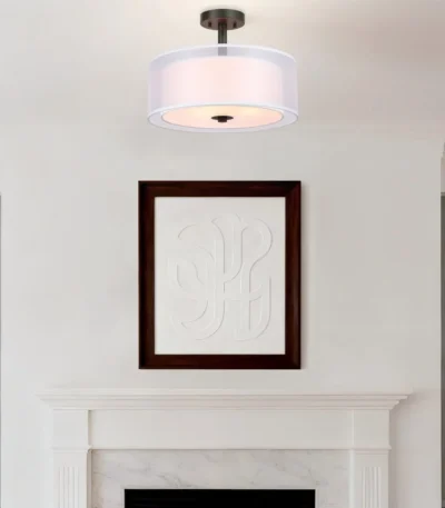 Goldoma modern fabric pendant light with three bulbs, hanging above a wooden dining table in a bright living room.