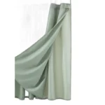 Modern grid sage green shower curtain with waterproof PEVA material in a bright bathroom