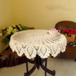 Vintage lace table mats in shabby chic style on a wooden table