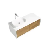 The vanity installed in a compact apartment bathroom, featuring a single door cabinet and soft-close hinges, with a