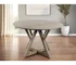 Goldoma 48-inch round pedestal dining table in rustic oak solid wood with pedestal base in a cozy dining room setting