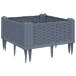 Blue grey polypropylene medium garden planter with flowers on patio