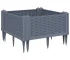 Blue grey polypropylene medium garden planter with flowers on patio