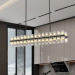 Goldoma 54-inch black rectangle G4 LED crystal chandelier hanging over a modern kitchen island