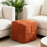 Brown corduroy ottoman foot rest with square shape and MDF frame in a modern living room setting.