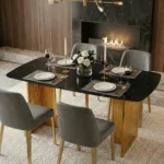 Modern glass dining table set with marble pattern and gold metal legs in a dining room setting