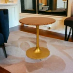 Brown and gold round pedestal small space dining table with solid wood top and iron base