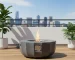 Eco-friendly petal-shaped propane fire bowl with blue flames on patio
