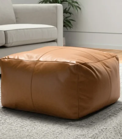 Goldoma 22 inch tan genuine leather pouf ottoman as a footrest