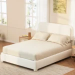 Goldoma queen bed frame with adjustable height headboard and curved cloud boucle upholstery in a modern bedroom setting