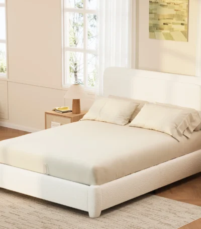 Goldoma queen bed frame with adjustable height headboard and curved cloud boucle upholstery in a modern bedroom setting
