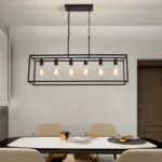 6-light black rectangular chandelier hanging over a wooden kitchen island with bar stools