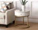 Modern nightstand with drawer featuring marble top and gold base in bedroom