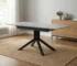 Modern square dining table for 4 with light gray MDF top and black metal legs in a cozy dining room