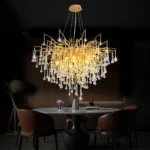 Modern crystal chandelier in black chrome and gold with raindrop crystals hanging in a living room