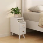Modern solid walnut nightstand with two drawers in a bedroom setting