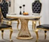 Elegant 47 inch round marble dining table with stainless steel base in a modern dining room