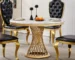 Elegant 47 inch round marble dining table with stainless steel base in a modern dining room