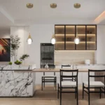 Brass globe pendant light illuminating a modern kitchen island