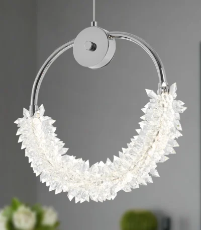 Goldoma 15.7 inch chrome iron LED crystal pendant chandelier hanging over a modern kitchen island with bar stools.