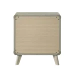 Modern nightstand with USB port and gold capped legs in bedroom setting