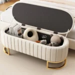 Goldoma velvet storage ottoman with button tufted design and sturdy metal legs in living room