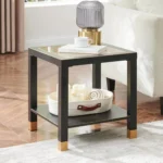 Square side table with tempered glass shelf and black and gold metal frame, modern design for living room or bedroom