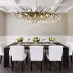 Modern black crystal chandelier with tree branch design in a living room