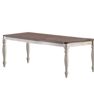 Antique white oval dining table with two leaves and oak veneer top, seating eight in a dining room