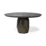 Round wood dining table in brown solid wood with pedestal base in a modern dining room