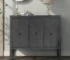 Entryway storage console with adjustable shelves and retro metal handles in a modern living room