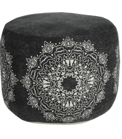 Goldoma 18-inch foldable pouf ottoman in black cotton with white medallion pattern, showcased in a living room as a stylish footrest