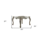 55-inch antiqued white solid wood dining table seating six in a modern dining room