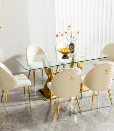 Modern glass dining table with stainless steel legs and clear tempered glass top