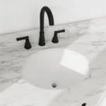 Close-up of the vintage-style sink basin with a brushed nickel faucet, highlighting the smooth ceramic surface and